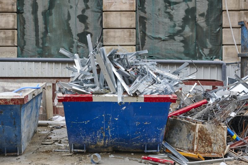 Removal of debris. Construction waste. Building demolition. Devastation background